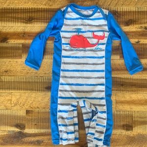 Full coverage infant swimsuit with matching hat